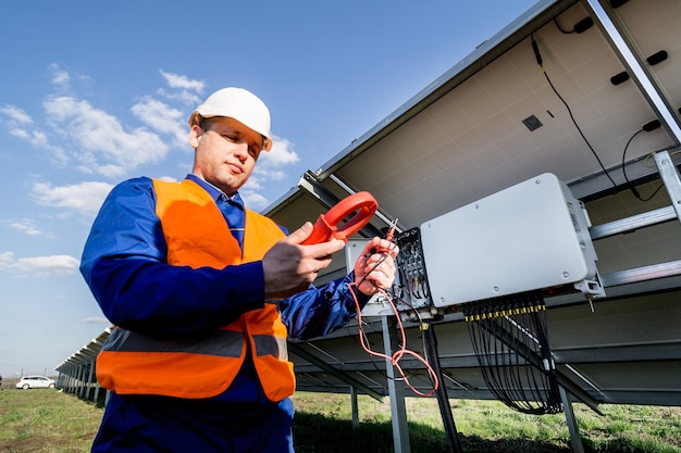 inspector-checks-actual-output-voltage-level-inverter_179755-11977