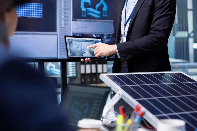 investors-examine-solar-panel-surface-using-tablet-discussing-design-efficiency_482257-123393