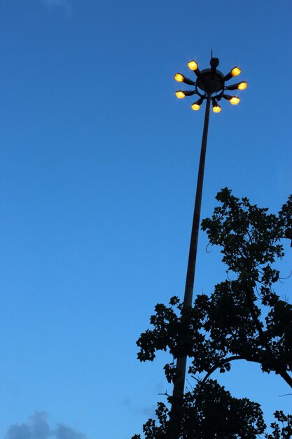 low-angle-view-windmill-against-clear-blue-sky_1048944-4805542