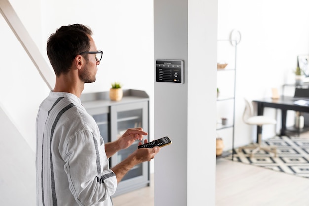 person-using-smartphone-his-automated-home_23-2149036904