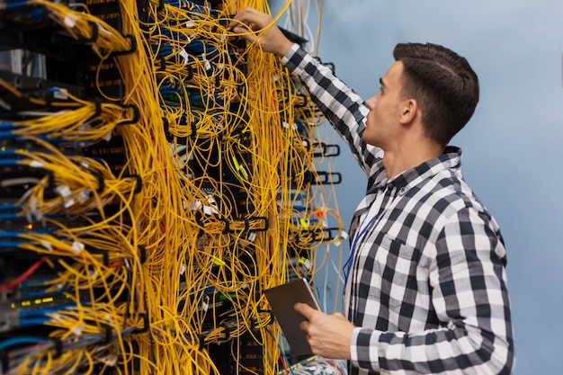 young-network-engineer-working-server-room_23-2148323441